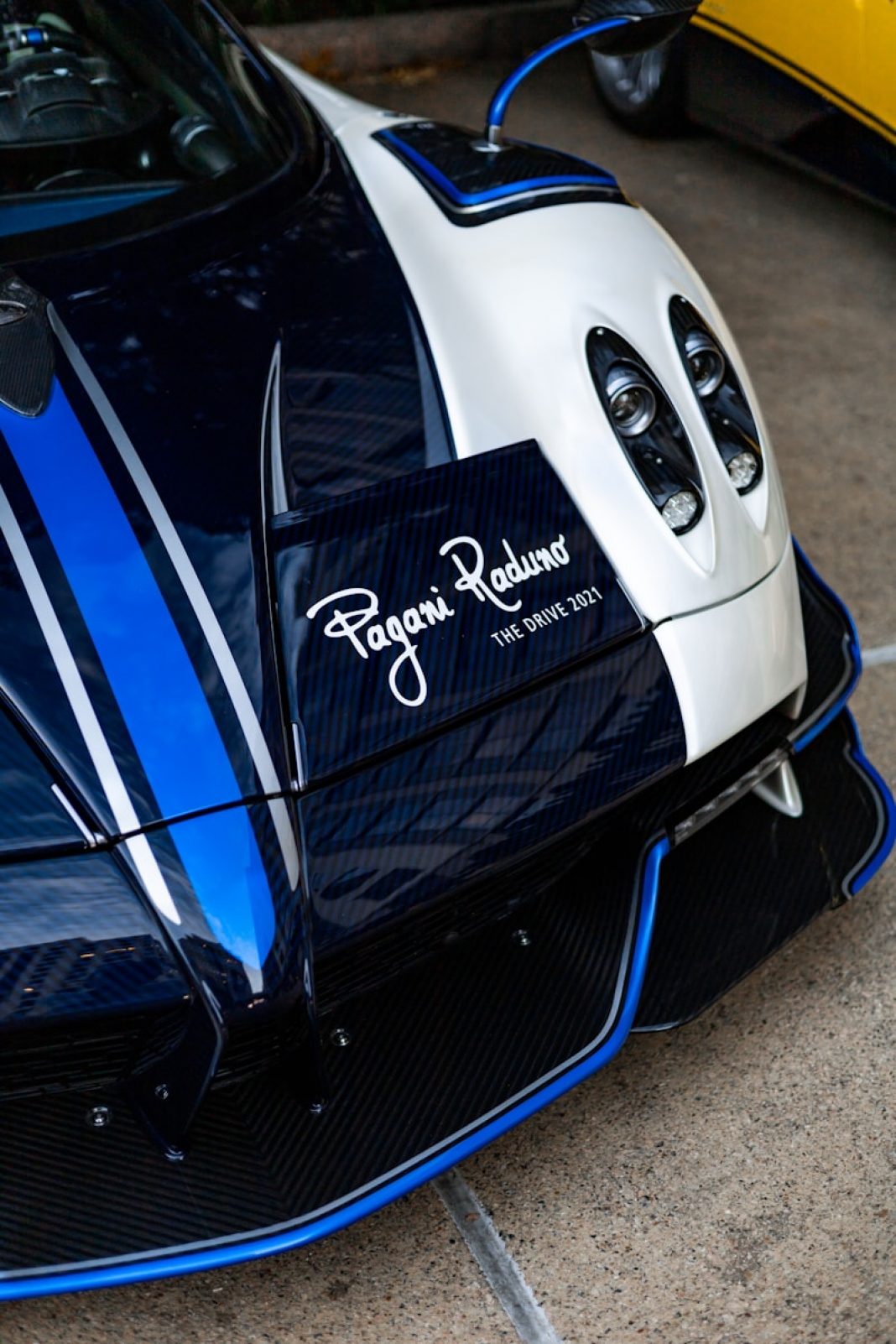 Photo by Wes Tindel a close up of a blue and white sports car